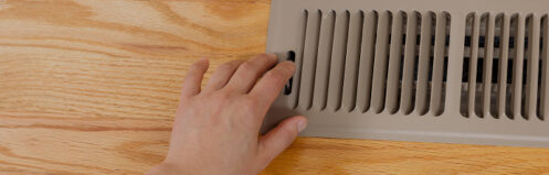 Person opening or shutting a floor vent