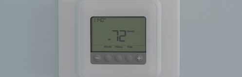 Thermostat on a wall set to 72 degrees
