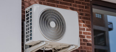 Ductless heat pump outside a Central Wisconsin residential home